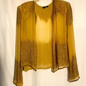 Gold NWT, hand beaded, silk women’s medium cardigan.